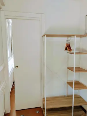 a closet with a white door and a shelf at Apartamento Puertomar in El Puerto de Santa María
