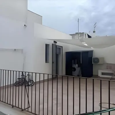 a balcony of a white building with a fence at Castelar in Rota