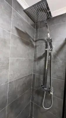a shower with a shower head in a bathroom at Viva Piso Jerez in Jerez de la Frontera