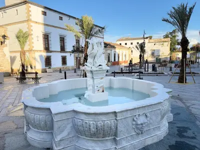 a fountain in the middle of a street at Kala Almendrillo Apartment Boutique in Jerez de la Frontera