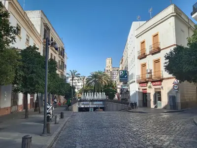 a cobblestone street in a city with buildings at Ático San Agustín - Panoramic View in Jerez de la Frontera