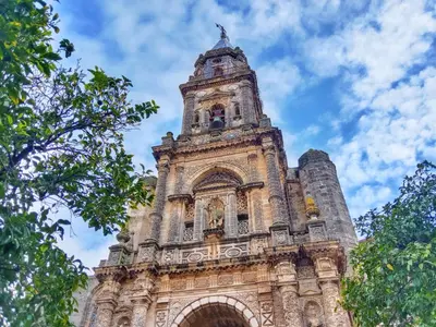 a building with a clock tower on top of it at Ático San Agustín - Panoramic View in Jerez de la Frontera