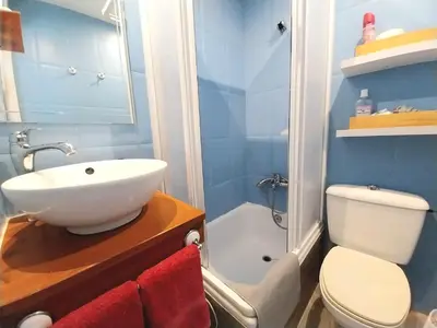a bathroom with a sink and a toilet and a shower at Ático San Agustín - Panoramic View in Jerez de la Frontera