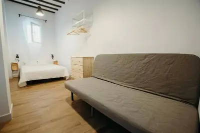 a bedroom with a bed and a mattressvisor at Habana Vieja Cádiz in Cádiz