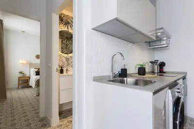 a kitchen with a sink and a counter top at Apartamento El Mural in Jerez de la Frontera