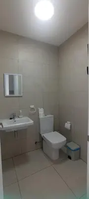 a bathroom with a toilet and a sink at APARTAMENTO TURISTICO EN LEBRIJA in Lebrija