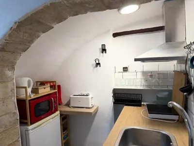 a kitchen with a sink and a microwave at Estudio Interior Kala - Only Adults - Private Room in Jerez de la Frontera