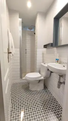 a bathroom with a toilet and a sink at Apto. en la playa del parque natural los Turuños in El Puerto de Santa María