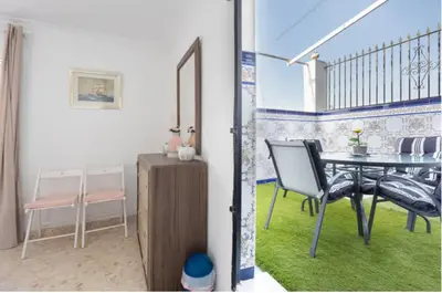 a dining room with a table and chairs on a balcony at La Rosa de Oro in Jerez de la Frontera