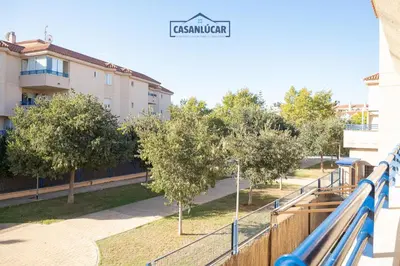 a view from a balcony of a park with trees at Vivienda Magallanes in Sanlúcar de Barrameda