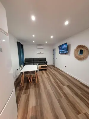 a living room with a couch and a table at Caímachado in Cádiz