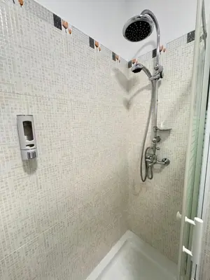 a shower with a shower head in a bathroom at Cabildo 2 in Sanlúcar de Barrameda