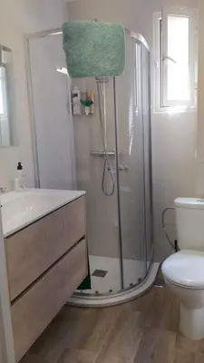 a bathroom with a shower and a toilet and a sink at Casa Ángeles in Cádiz