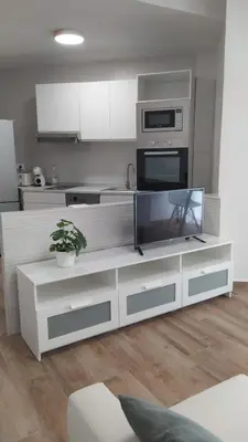 a kitchen with a counter with a fish tank on it at Casa Ángeles in Cádiz