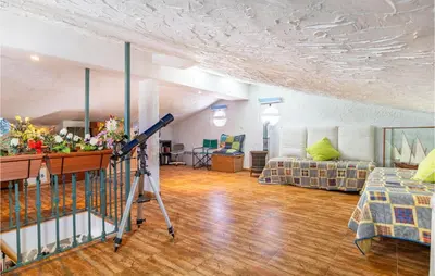 a living room with a camera in the middle of a room at Lovely Home In Chiclana De La Fronter in Chiclana de la Frontera