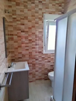 a bathroom with a sink and a toilet at Casa Caleta in Conil de la Frontera