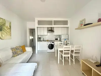 a living room with a couch and a table at Pescadores del Sur in Chiclana de la Frontera