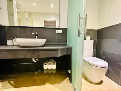 a bathroom with a sink and a toilet at Amanecer frente al Mar Grupo AC Gestion in Cádiz