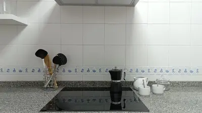 a kitchen counter with a coffee maker on a counter top at Sherryflat Aina Parking in Jerez de la Frontera