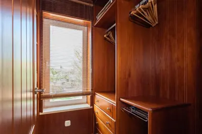 a small kitchen with wooden walls and a window at Arcos Gardens Sol Rent Golf in Arcos de la Frontera