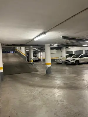 an empty parking garage with cars parked in it at Duplex con garaje privado in Cádiz