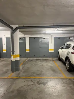 a parking garage with a car parked in it at Duplex con garaje privado in Cádiz