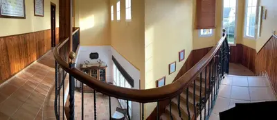 a spiral staircase in a home with a staircase at Casa Victoria in Arcos de la Frontera