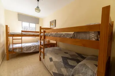 a room with two bunk beds and a window at Casa rural El Tejar de Algar / 1262 in Algar
