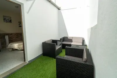 a room with chairs and a room with green grass at Casa rural El Tejar de Algar / 1262 in Algar