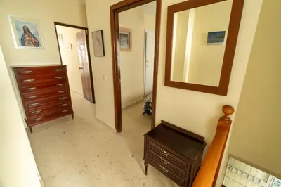 a hallway with a dresser and a mirror at Casa rural El Tejar de Algar / 1262 in Algar
