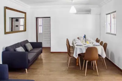 a dining room with a table and a couch at Villa San Patricio I Piscina Privada I Jacuzzi Spa I BBQ I PS5 I Aire Acon I 3000m2 I 5min-Centro in Jerez de la Frontera