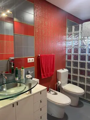 a bathroom with a toilet and a sink at Villa Sagrario in Chiclana de la Frontera