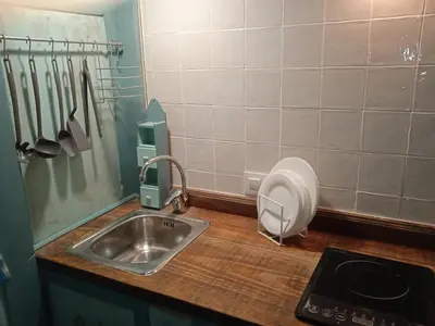 a kitchen counter with a sink and a mixer at La gota de leche 3 in Sanlúcar de Barrameda