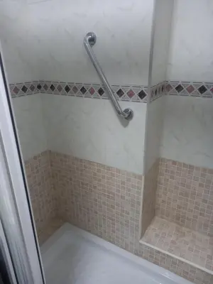 a shower stall with a tub and a shower curtain at Primera línea Valdelagrana in El Puerto de Santa María