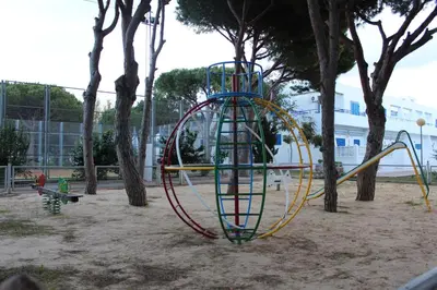 a playground with a roller coaster in a park at Apartamento Red de Almadraba in Chiclana de la Frontera