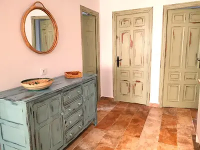 a bathroom with a blue dresser and a mirror at Olas de Conil in Conil de la Frontera