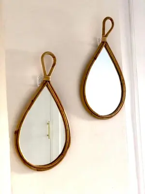 a pair of mirrors hanging on a wall at Primera linea playa valdelagrana vistas al mar in El Puerto de Santa María