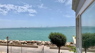 a view of the ocean from a house at Espectacular apartamento frente al mar in El Puerto de Santa María