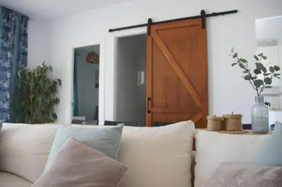 a white couch with pillows in a living room at Casa de la Paz / Andalucia in Hozanejos
