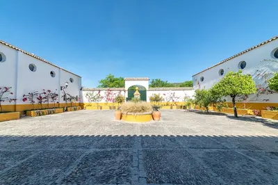 a courtyard of a building with plants in the middle at Private Villa Cortijo Sierra y Lago with private swimming pool in Arcos de la Frontera
