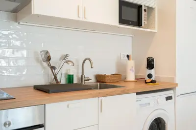 a kitchen with a sink and a dishwasher at Apartoyou - Vistahermosa Bahía in El Puerto de Santa María