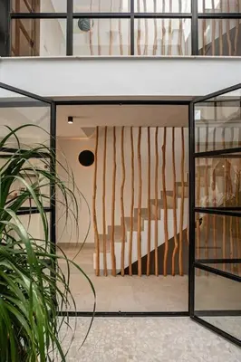 a glass door with a staircase in a building at Ocean beachside house with pool 46 in Conil de la Frontera