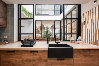 a kitchen with a sink and a large window at Ocean beachside house with pool 46 in Conil de la Frontera
