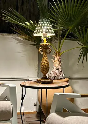 a table with a lamp and some plants on it at La Terraza de Porvenir 10 - Jerez de la Frontera in Jerez de la Frontera