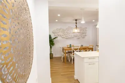 a kitchen and dining room with a dining table at Zurbarán by Gades Gestión in Cádiz