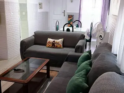 a living room with a couch and a coffee table at casa familiar in San Fernando