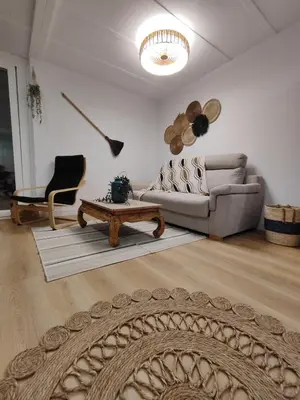 a living room with a couch and a coffee table at TITO MIGUEL VILLAGE in Chiclana de la Frontera