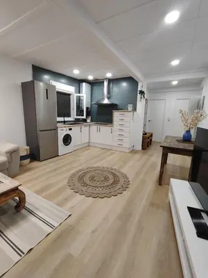 a large room with a kitchen and a living room at TITO MIGUEL VILLAGE in Chiclana de la Frontera