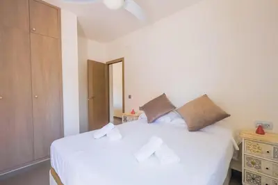 a bathroom with a shower with a white shower head at GuestReady - Sanlucar Piletas Beach in Sanlúcar de Barrameda