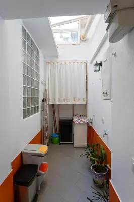 a small bathroom with a toilet and a window at PUERTA del MAR Family Home by Cadiz4Rentals in Cádiz